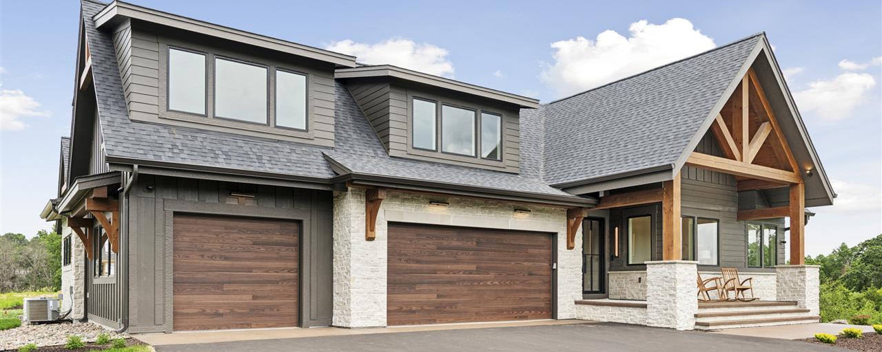 Luxury suburban home with garage and driveway