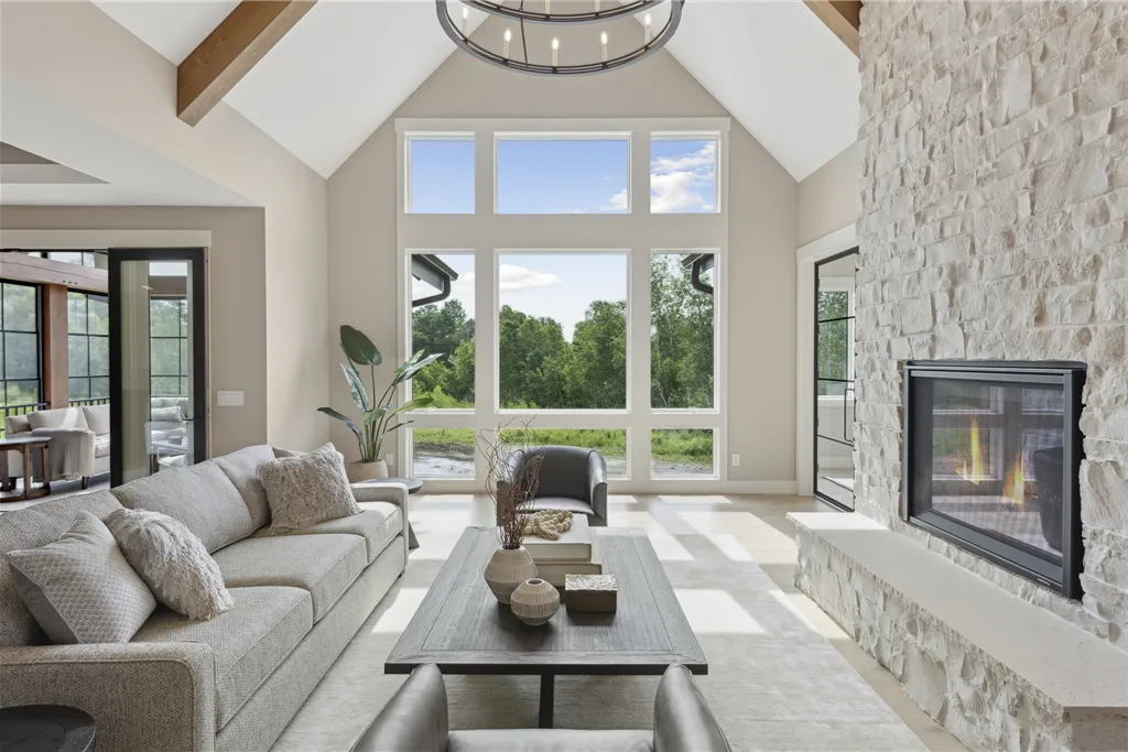 Luxurious minimalist family room with a fireplace and contemporary design.