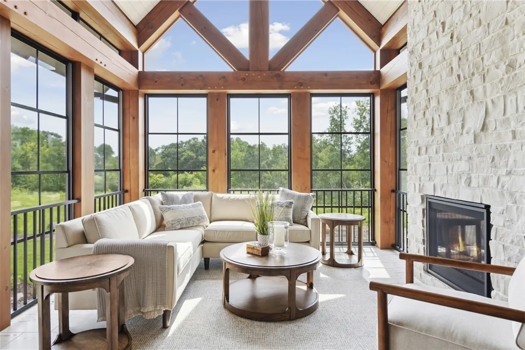 Luxurious contemporary living room with large windows and modern furniture.