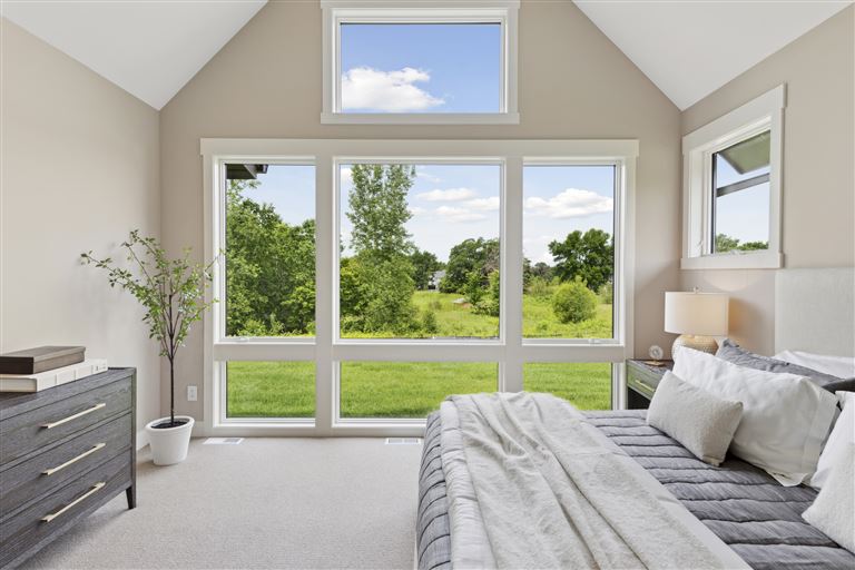Contemporary minimalist bedroom with luxury design and modern furniture.