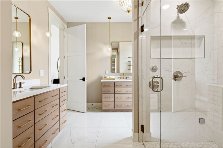 Luxurious contemporary bathroom with minimalist design, featuring a mirror, shower, faucet, and bathtub.