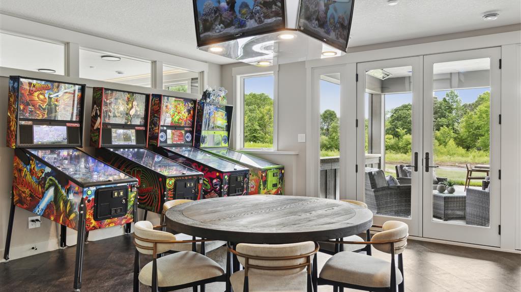 Luxurious contemporary living room with elegant furniture and large windows.