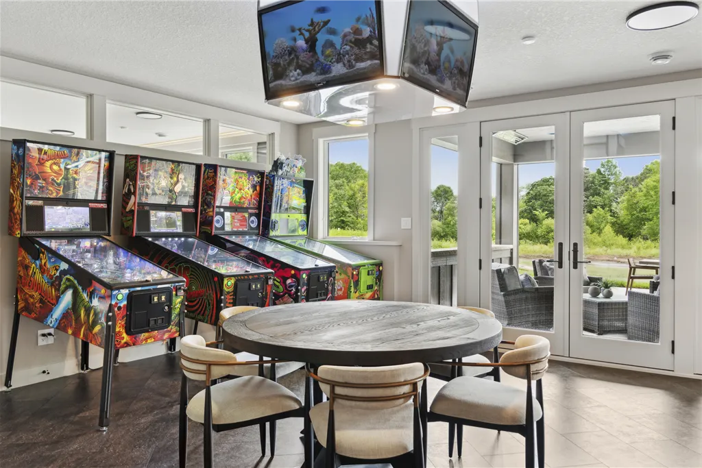 Luxurious contemporary living room with elegant furniture and large windows.