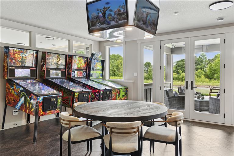 Luxurious contemporary living room with elegant furniture and large windows.