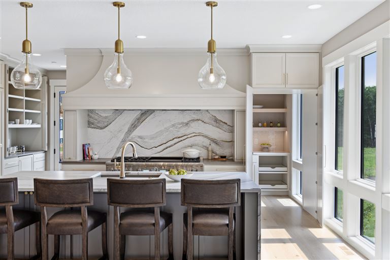 Contemporary dining room with luxury furniture and large windows.