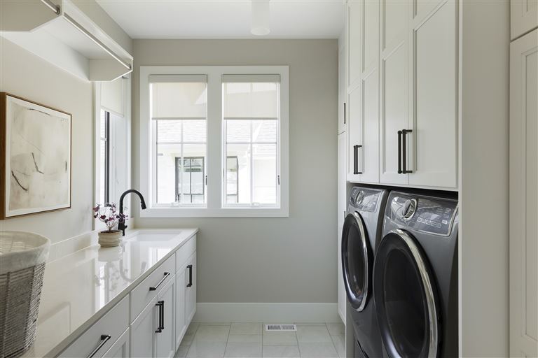 Luxurious contemporary bathroom with modern design and large window.