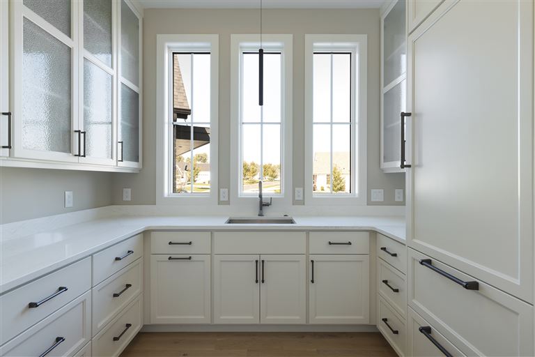 Contemporary minimalist family room with modern furniture and large window.