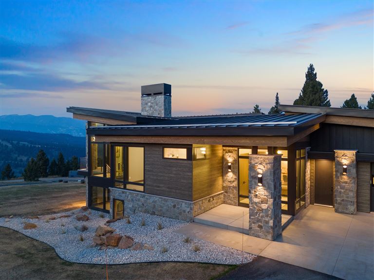 Charming bungalow with a porch at sunset