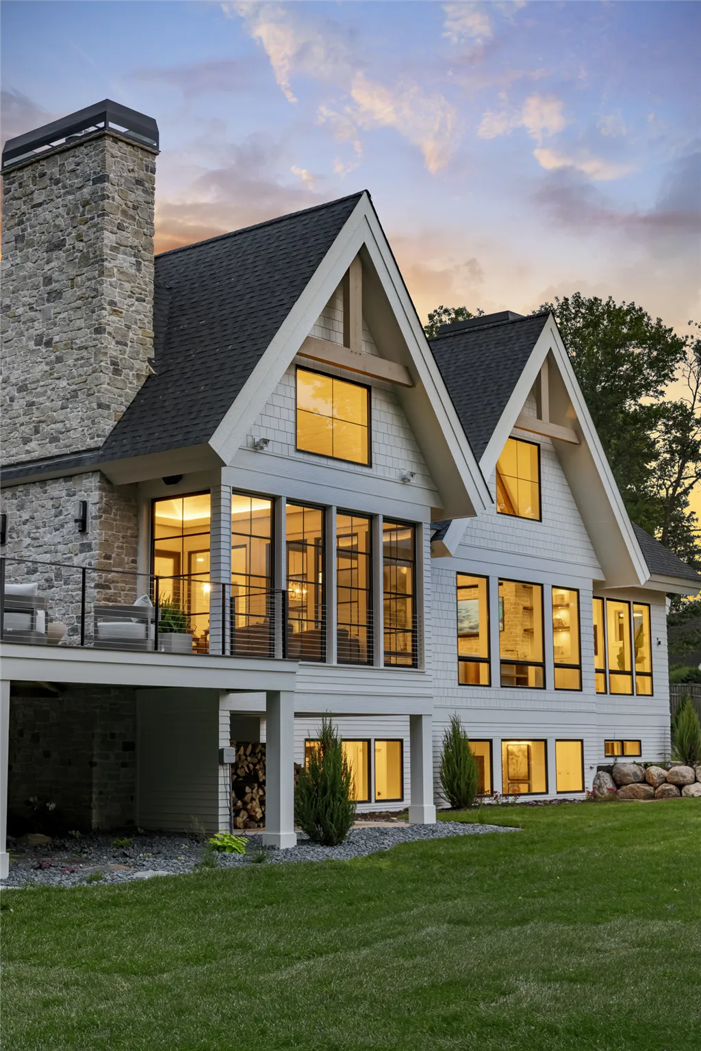 Elegant suburban home in Stillwater, MN at twilight with a spacious driveway and well-maintained lawn.