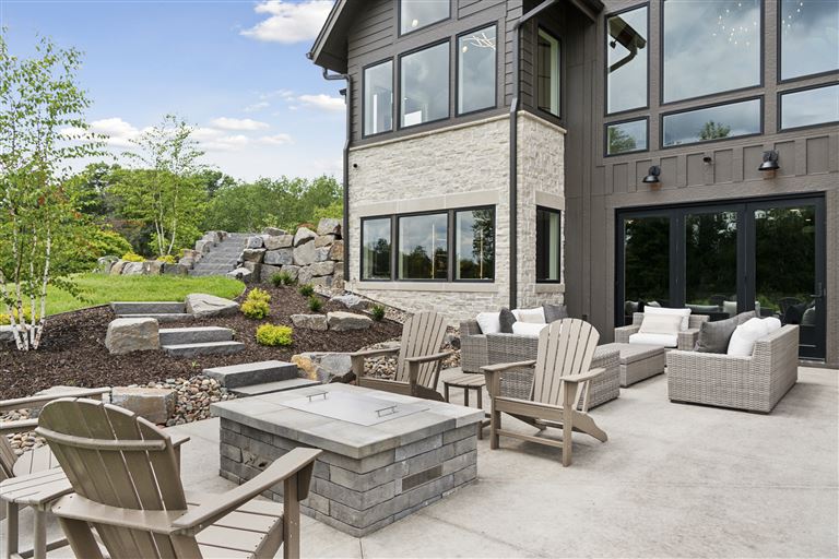 Luxury contemporary patio with seating and garden view