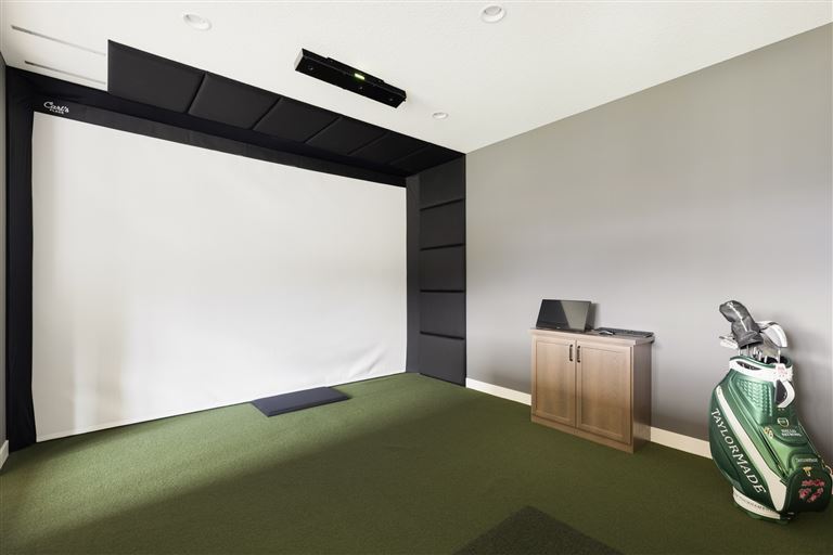 Luxurious minimalist family room with contemporary furniture and broad parquet flooring.