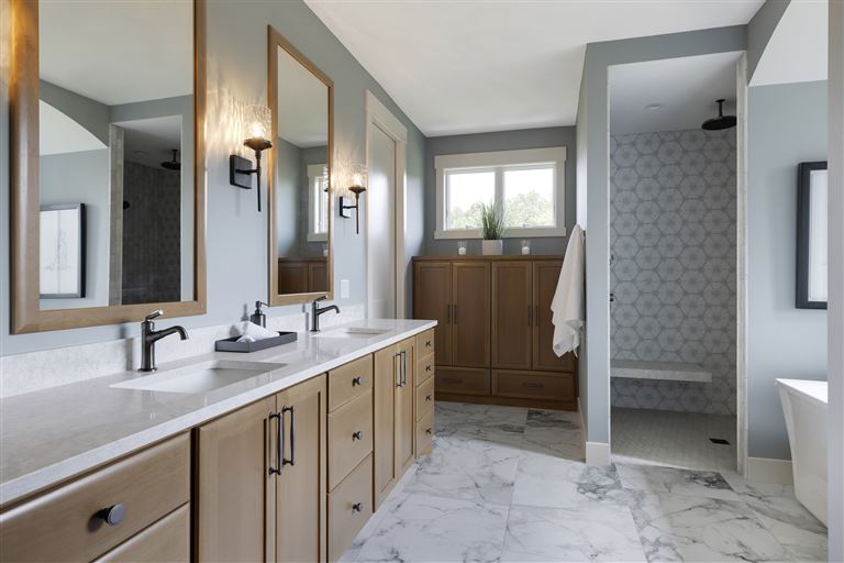 Luxurious contemporary bathroom with minimalist design, featuring a bathtub, faucet, cabinet, and window.