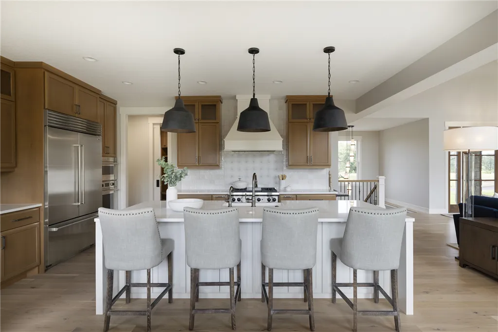 Contemporary minimalist dining room with modern furniture and large windows.