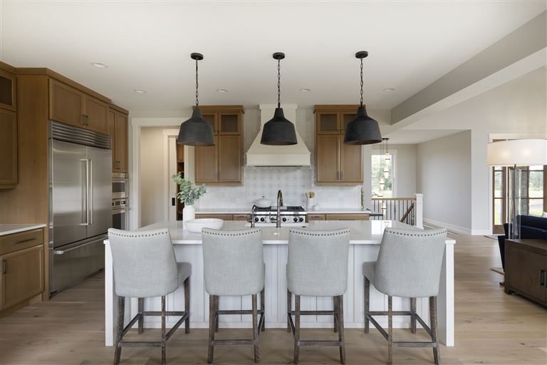 Contemporary minimalist dining room with modern furniture and large windows.