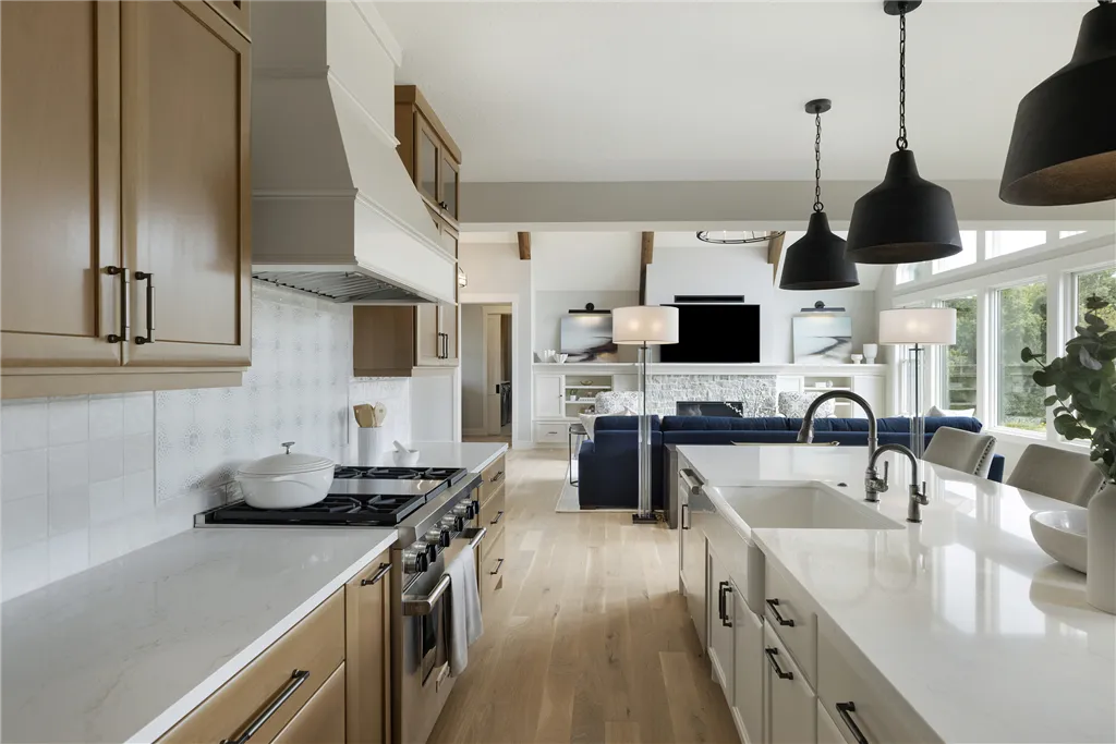 Contemporary minimalist kitchen with stainless steel appliances and modern cabinetry.