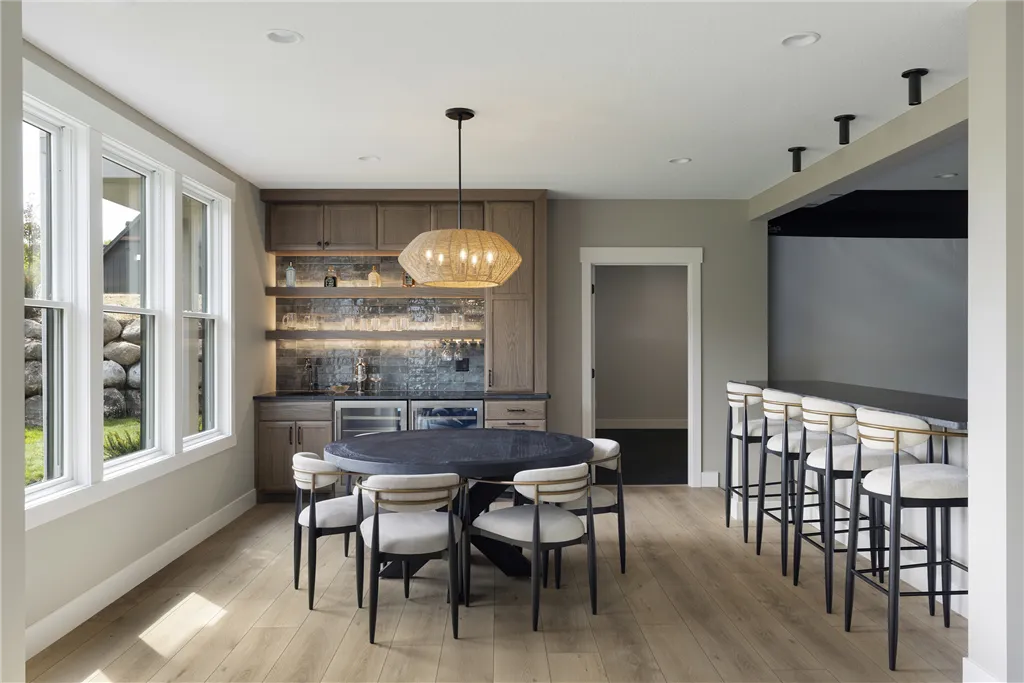 Luxury dining room with contemporary furniture and large windows.