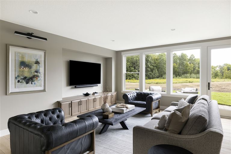 Contemporary minimalist living room with sofa and fireplace by Hartman Homes.