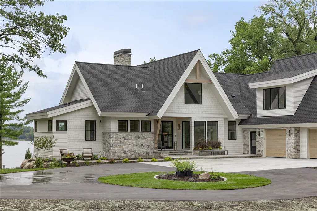 Upscale suburban home with driveway and lawn