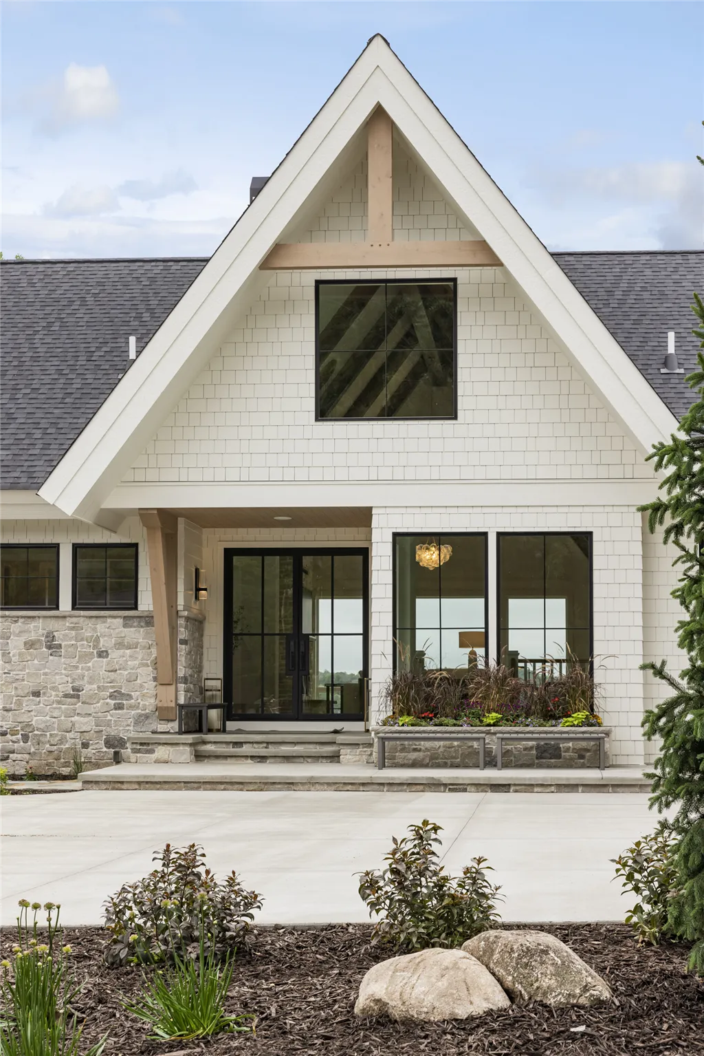 Luxury suburban home with a spacious yard and driveway.