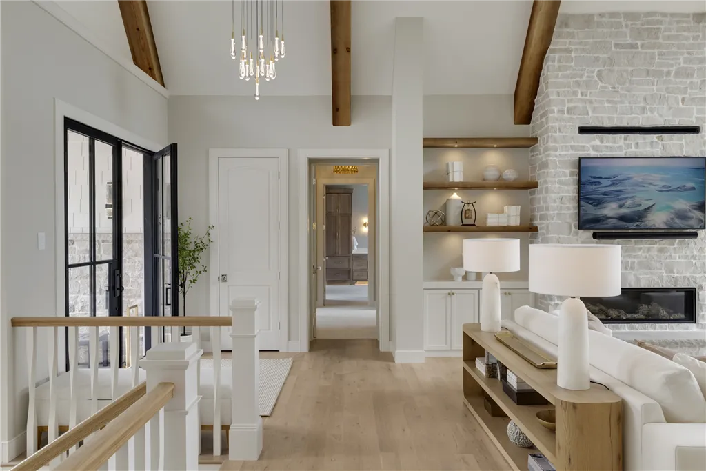 Contemporary minimalist living room with luxury furnishings and large windows.
