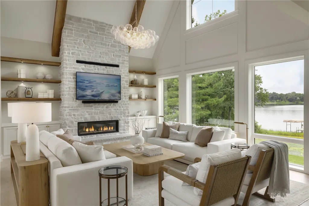 Luxurious contemporary living room with modern furniture including a sofa, chair, coffee table, and decorative rug.