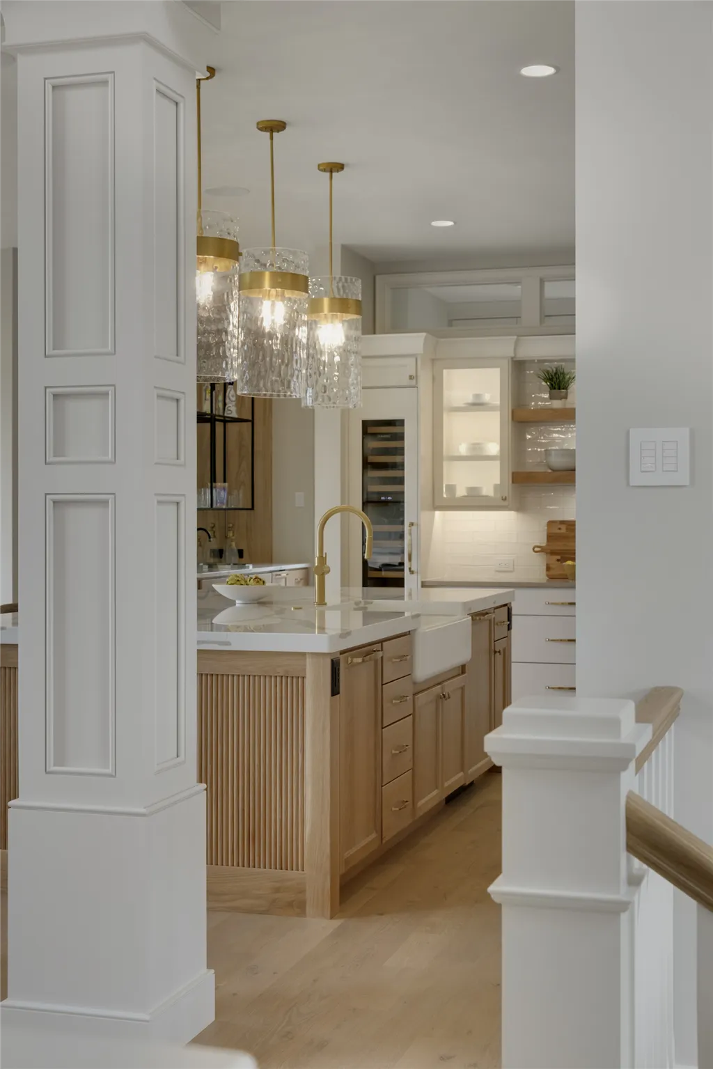 Luxurious contemporary bathroom with modern cabinetry and large mirror.