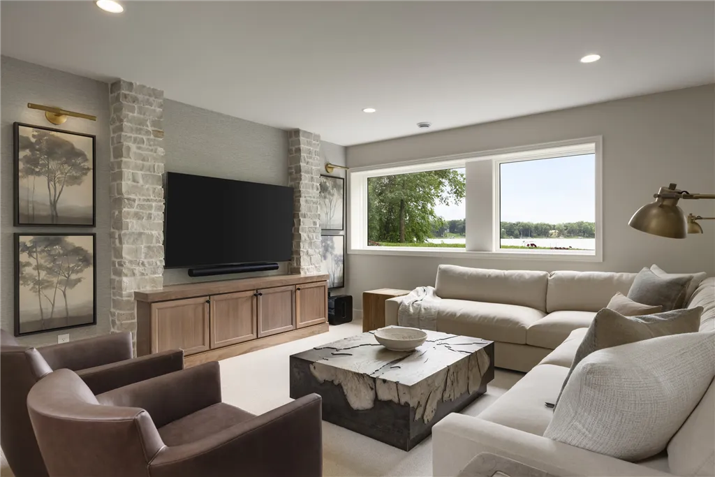 Contemporary minimalist living room with sofa, coffee table, and fireplace.