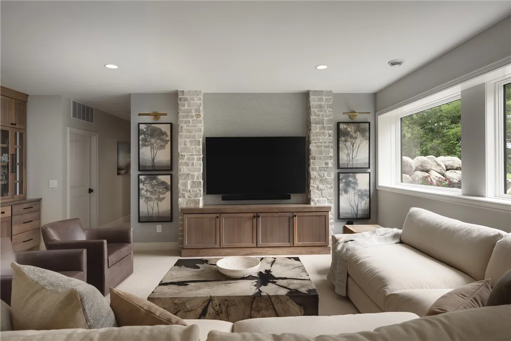 Contemporary living room with sofa, fireplace, and minimalist design.
