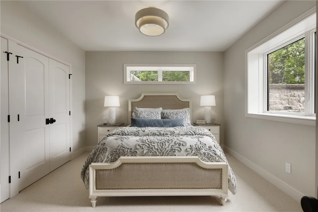 Luxurious contemporary bedroom with minimalist design by Hartman Homes.